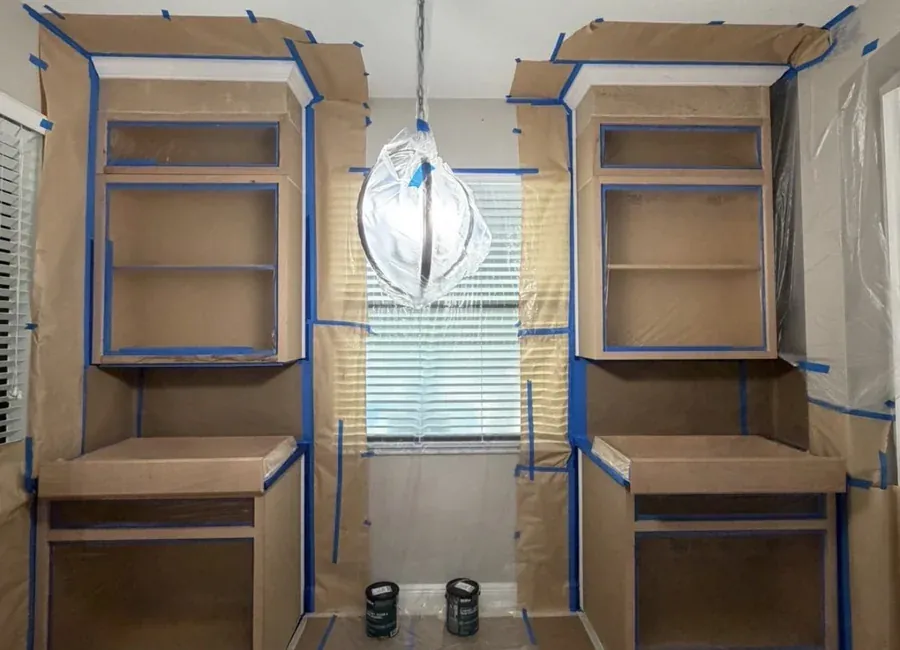 Built-in shelving masked off and primed mid-respray