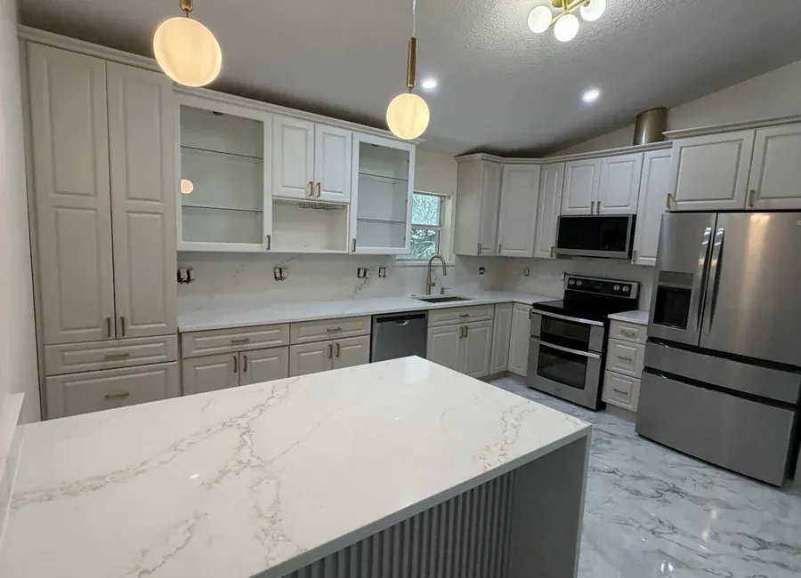 Refinished kitchen cabinets with a smooth painted finish