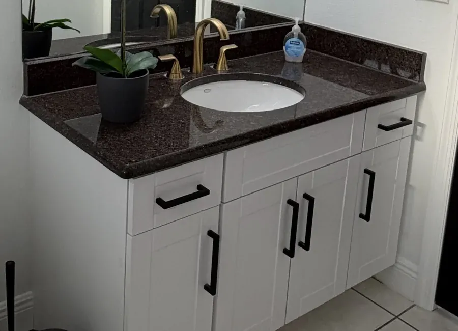 Repainted bathroom vanity with a clean, durable finish