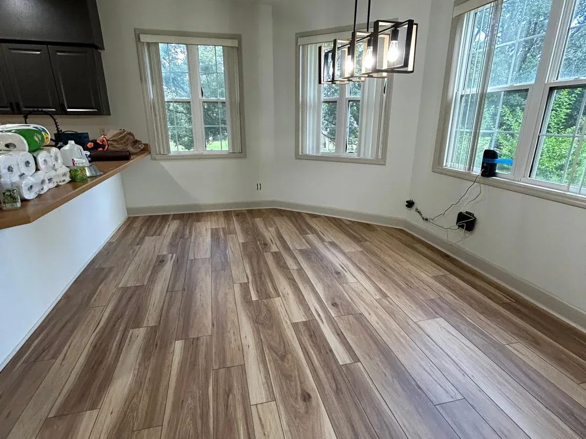 Newly installed luxury vinyl plank flooring in a bright room