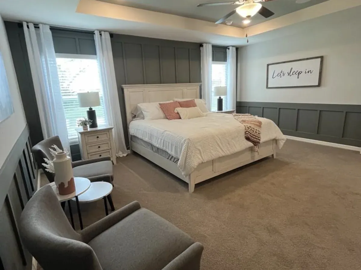 Freshly painted bedroom interior with a board-and-batten accent wall