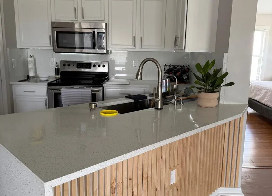 Repainted kitchen cabinetry and trim in a clean finish